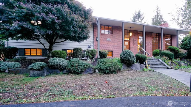 a front view of a house with garden
