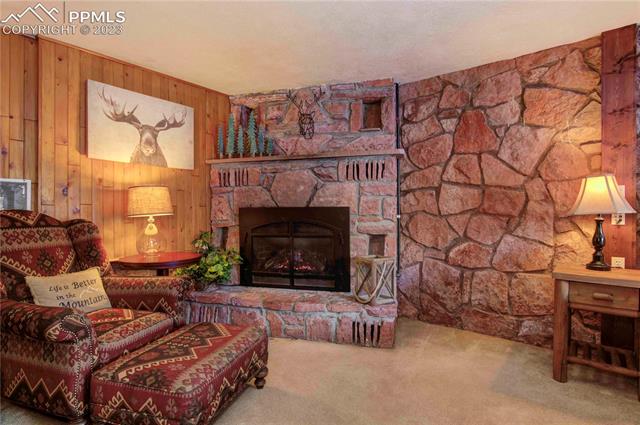 5790 Ona Road Cascade, CO 80809 - Photo 24 of 32 Gorgeous, large gas, stone fireplace.
