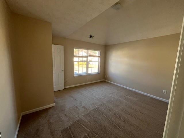 303 Millstone Drive Hampton, GA 30228 - Photo 14 of 16 an empty room with windows