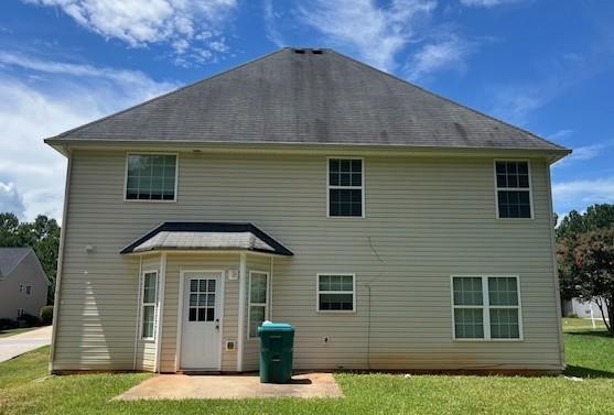 303 Millstone Drive Hampton, GA 30228 - Photo 16 of 16 a front view of a house with a yard