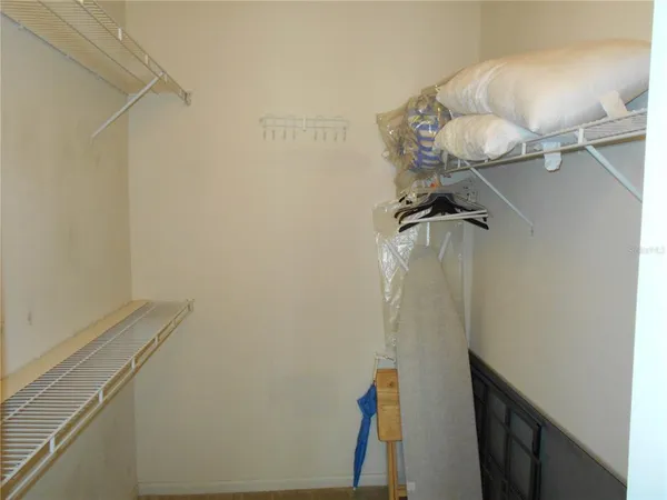 a bathroom with a light fixture and a shower