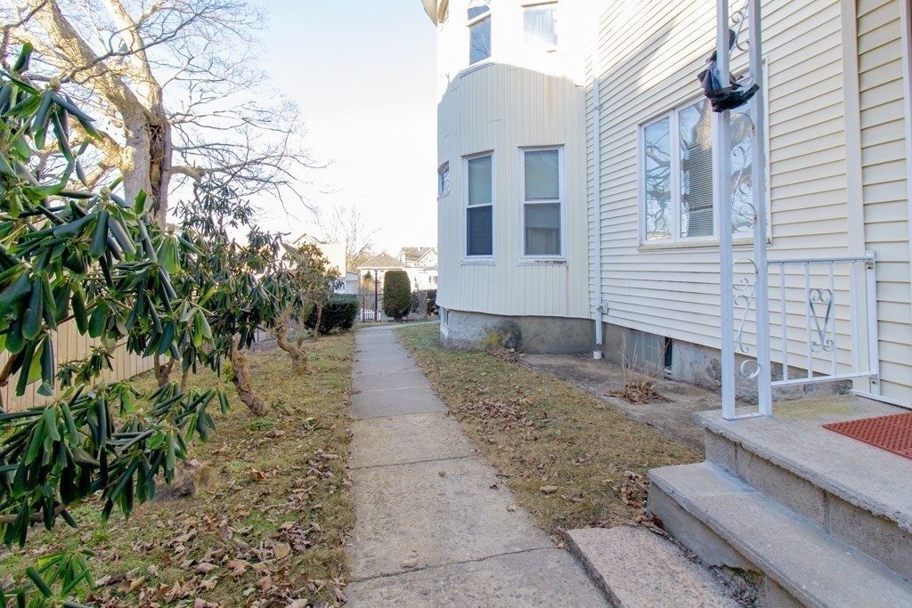 247 Rock Street Fall River, MA 02720 - Photo 3 of 30 a view of a backyard with sitting area