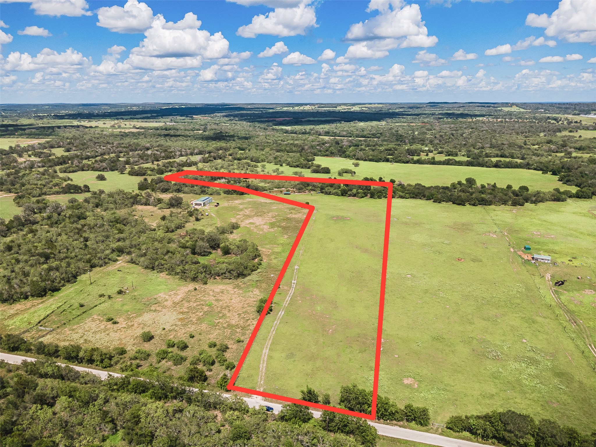 3109 Tenney Creek Road Dale, TX 78616 - Photo 5 of 23 A sweeping aerial view reveals a vast expanse of verdant land, ready for your vision.