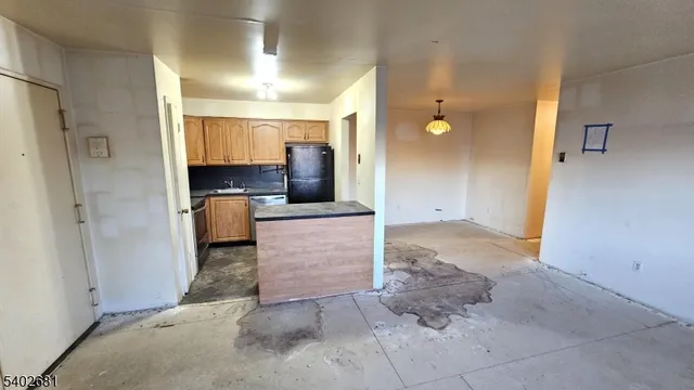 a view of a kitchen from the hallway