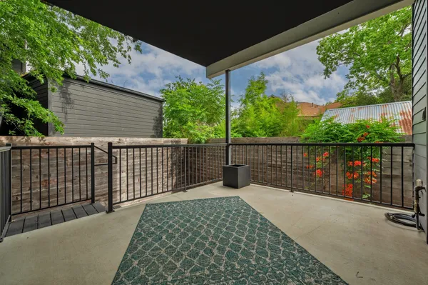 a balcony view with a garden