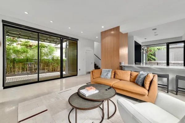 a living room with furniture and a large window
