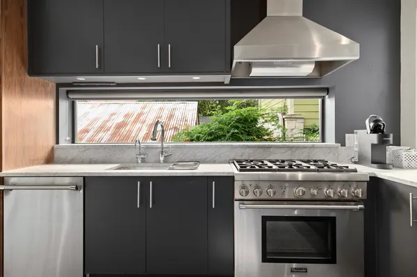 a kitchen with a stove and a sink