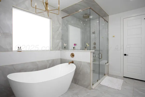 a white bath tub sitting in a bathroom