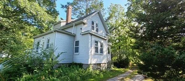 a view of a house with a yard and plants
