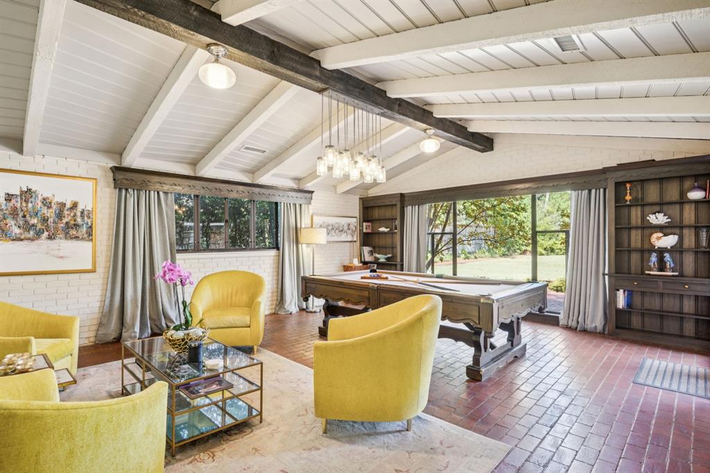 4549 Walnut Hill Lane Dallas, TX 75229 - Photo 12 of 40 a living room with furniture and a large window