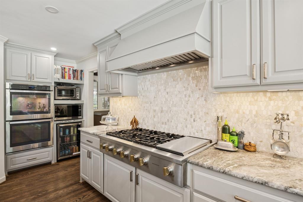 4549 Walnut Hill Lane Dallas, TX 75229 - Photo 16 of 40 a kitchen with granite countertop stainless steel appliances and counter space
