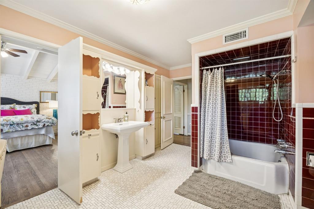 4549 Walnut Hill Lane Dallas, TX 75229 - Photo 21 of 40 a living room with furniture and a fireplace