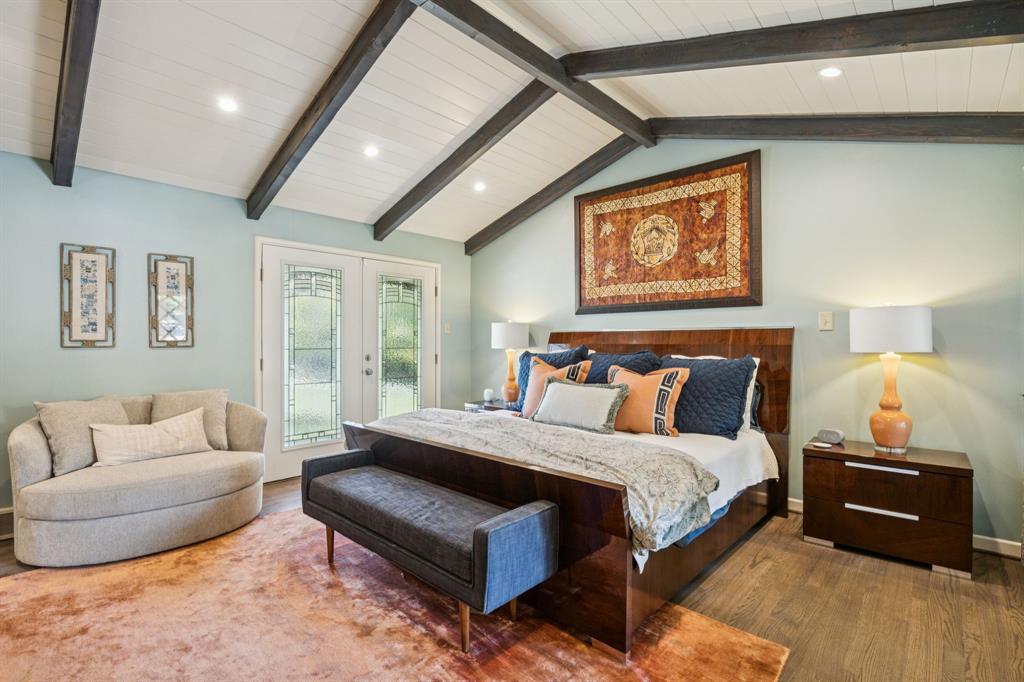 4549 Walnut Hill Lane Dallas, TX 75229 - Photo 23 of 40 a bedroom with furniture and a couch