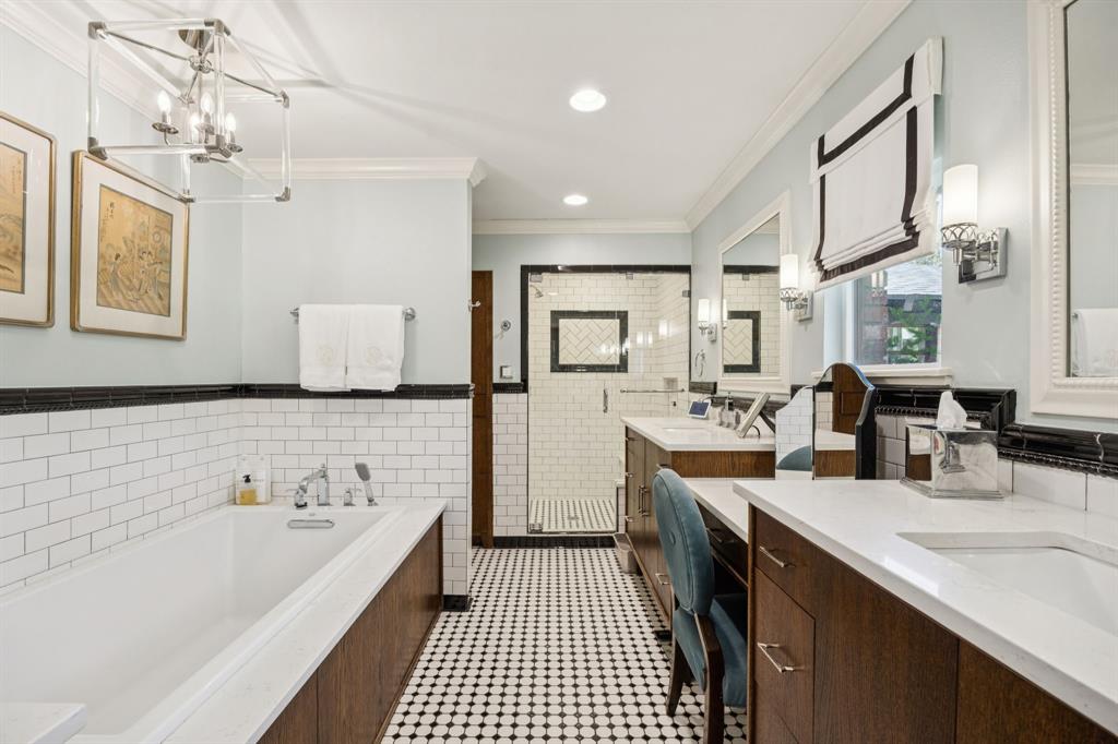 4549 Walnut Hill Lane Dallas, TX 75229 - Photo 26 of 40 a bathroom with a tub sink and mirror