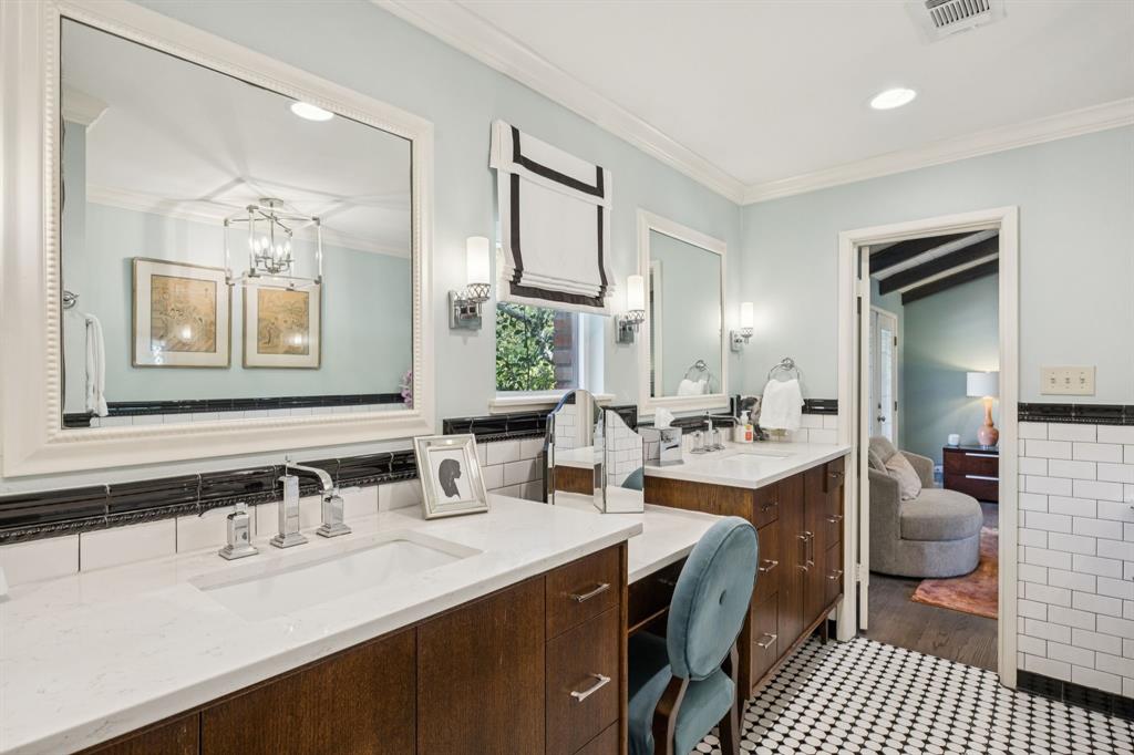 4549 Walnut Hill Lane Dallas, TX 75229 - Photo 27 of 40 a bathroom with a sink double vanity and a mirror