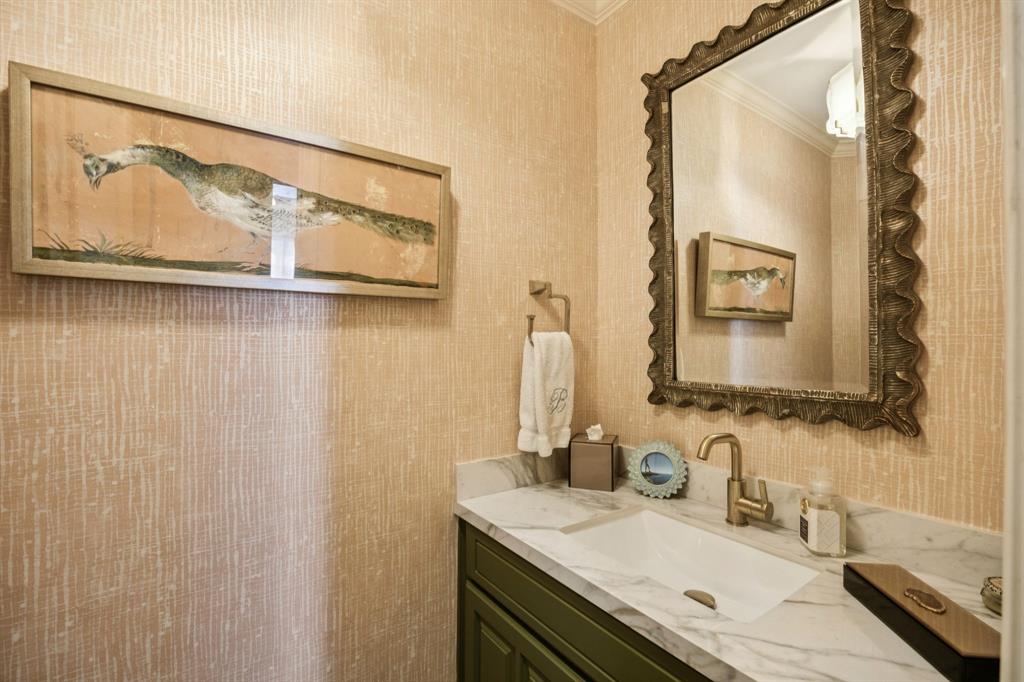 4549 Walnut Hill Lane Dallas, TX 75229 - Photo 30 of 40 a bathroom with a granite countertop sink and a mirror