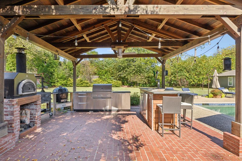 4549 Walnut Hill Lane Dallas, TX 75229 - Photo 31 of 40 a view of a chairs and table in the patio