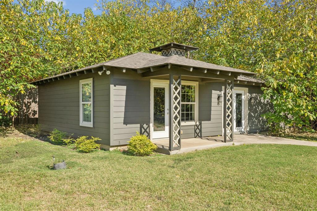 4549 Walnut Hill Lane Dallas, TX 75229 - Photo 33 of 40 a front view of a house with garden
