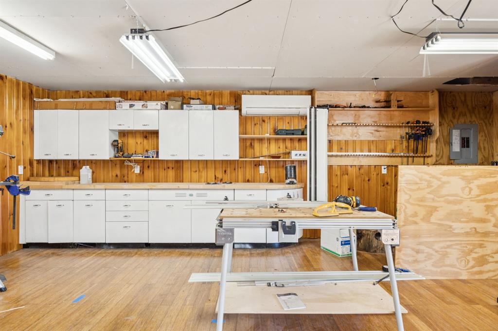 4549 Walnut Hill Lane Dallas, TX 75229 - Photo 34 of 40 a kitchen with stainless steel appliances kitchen island granite countertop a sink and cabinets