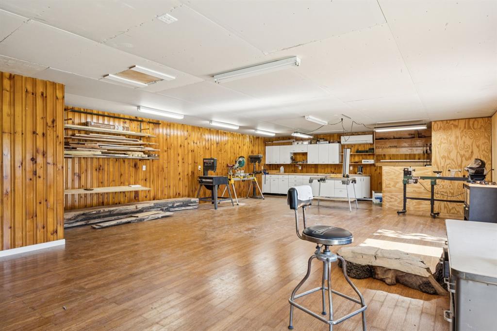 4549 Walnut Hill Lane Dallas, TX 75229 - Photo 35 of 40 a dining room with wooden floor and furniture