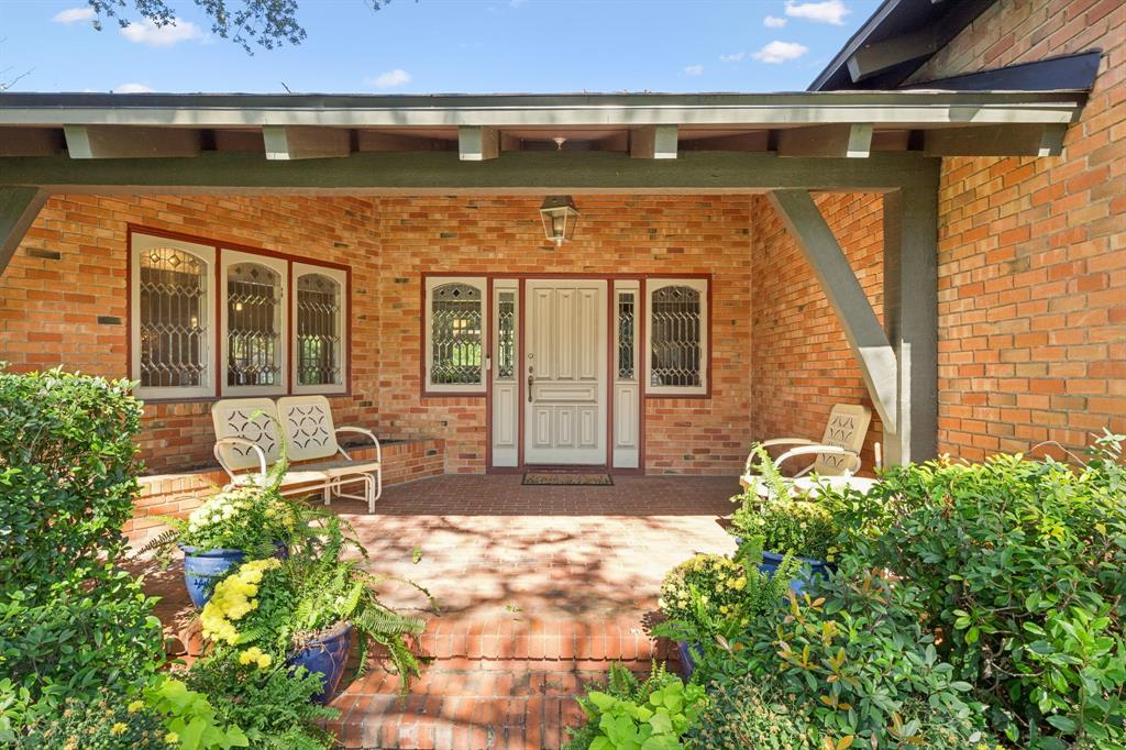 4549 Walnut Hill Lane Dallas, TX 75229 - Photo 5 of 40 a front view of a house with a large window