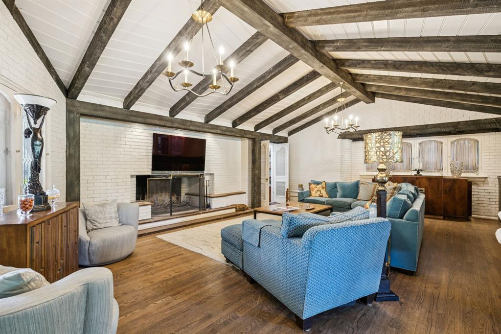 4549 Walnut Hill Lane Dallas, TX 75229 - Photo 7 of 40 a living room with furniture and a flat screen tv