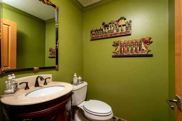 a bathroom with a sink a mirror and a toilet