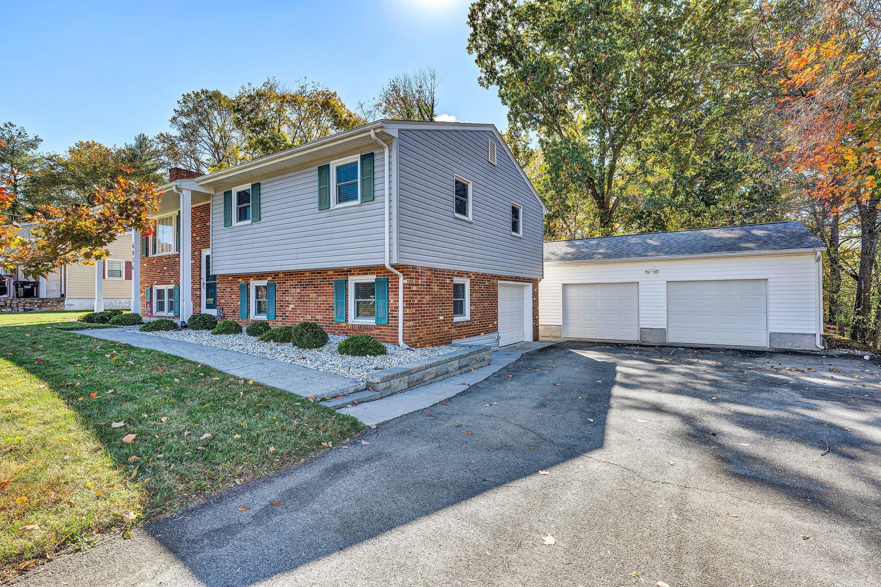 6836 Trevilian Road Roanoke, VA 24019 - Photo 1 of 47 a view of a yard in front of a white house