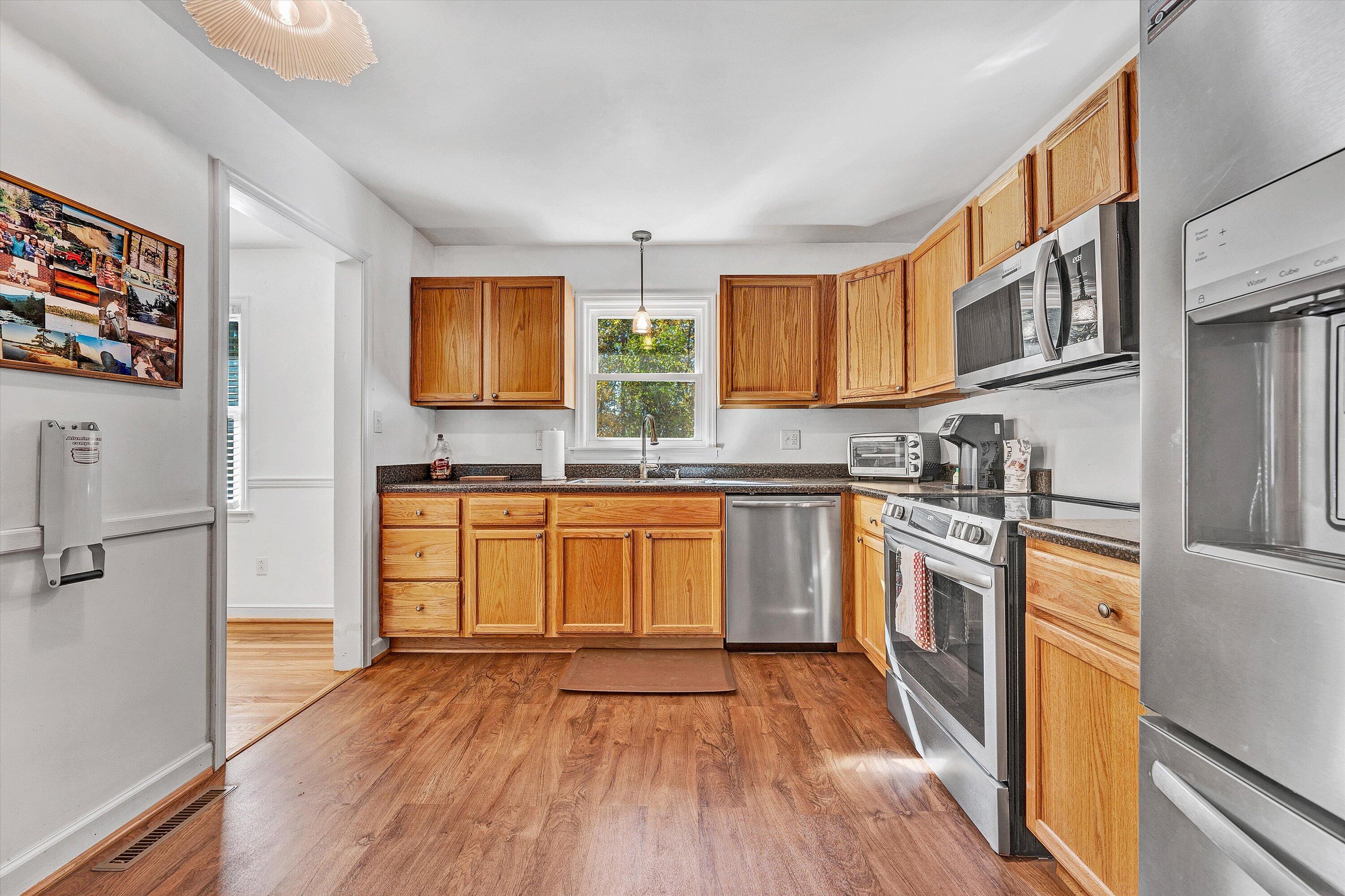 6836 Trevilian Road Roanoke, VA 24019 - Photo 15 of 47 a kitchen with stainless steel appliances granite countertop a stove and a sink
