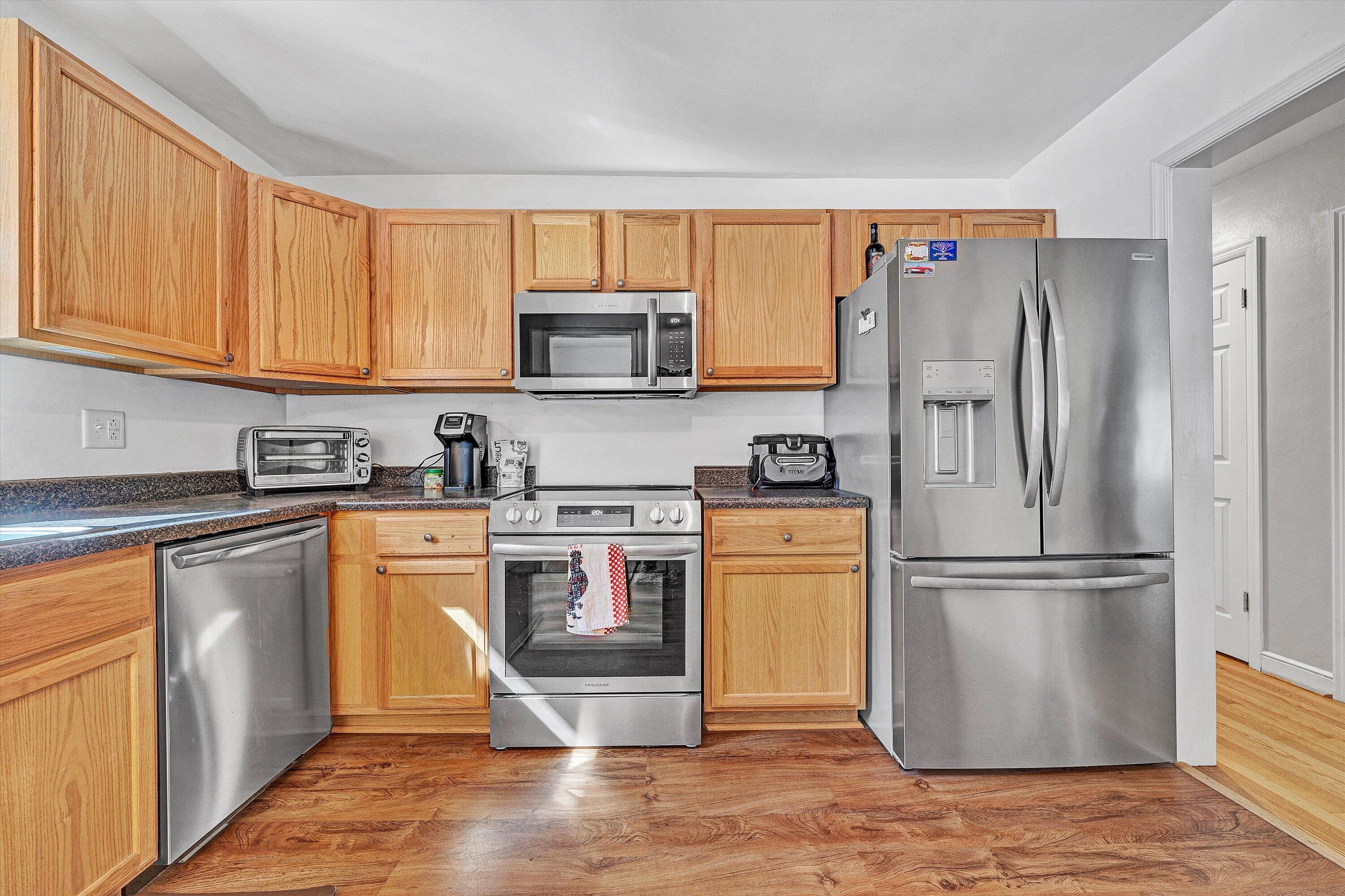 6836 Trevilian Road Roanoke, VA 24019 - Photo 16 of 47 a kitchen with stainless steel appliances granite countertop a refrigerator stove top oven and sink
