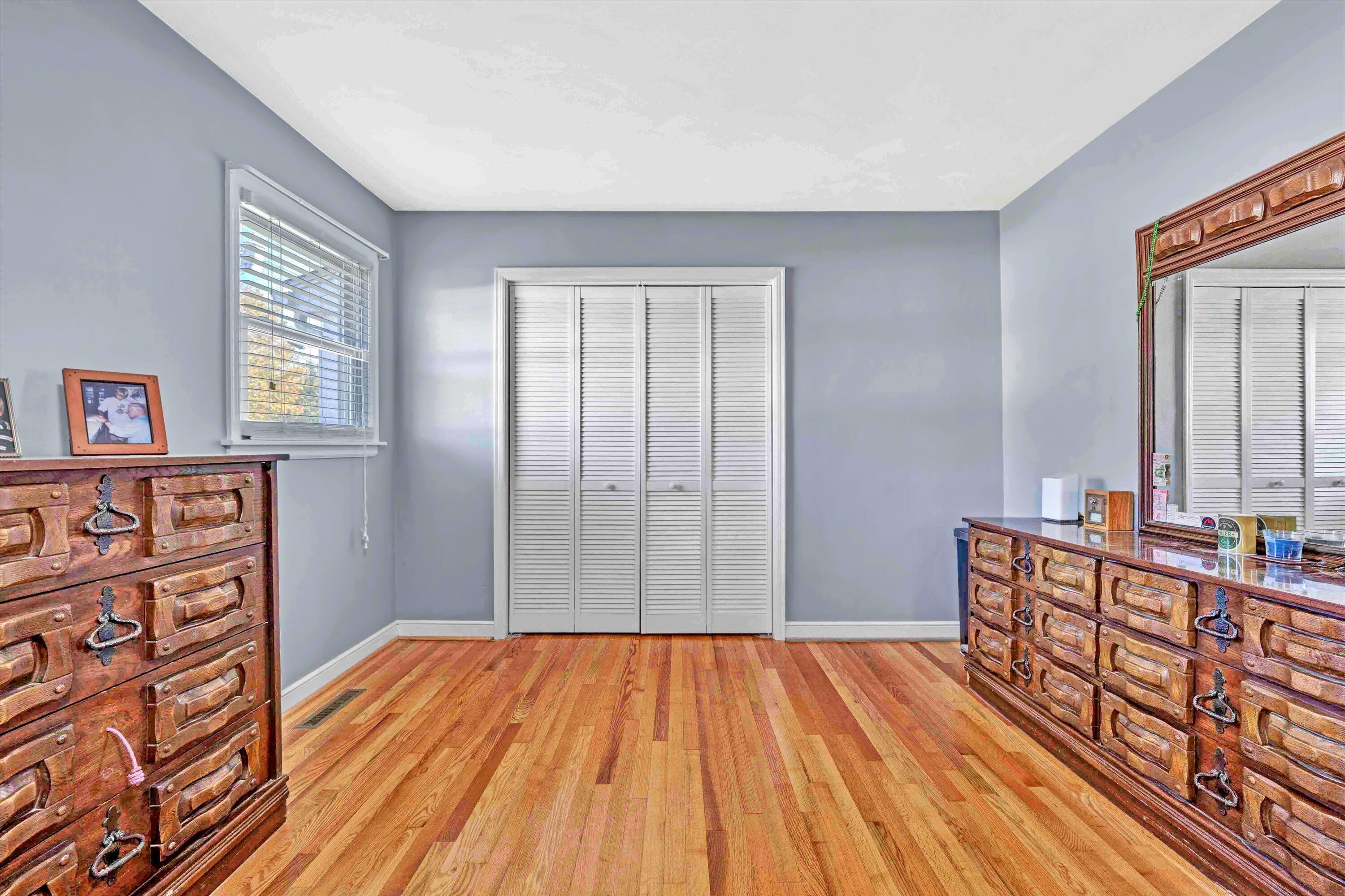 6836 Trevilian Road Roanoke, VA 24019 - Photo 23 of 47 a room with wooden floor and windows