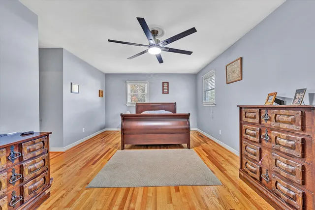 a living room with furniture and a book shelf