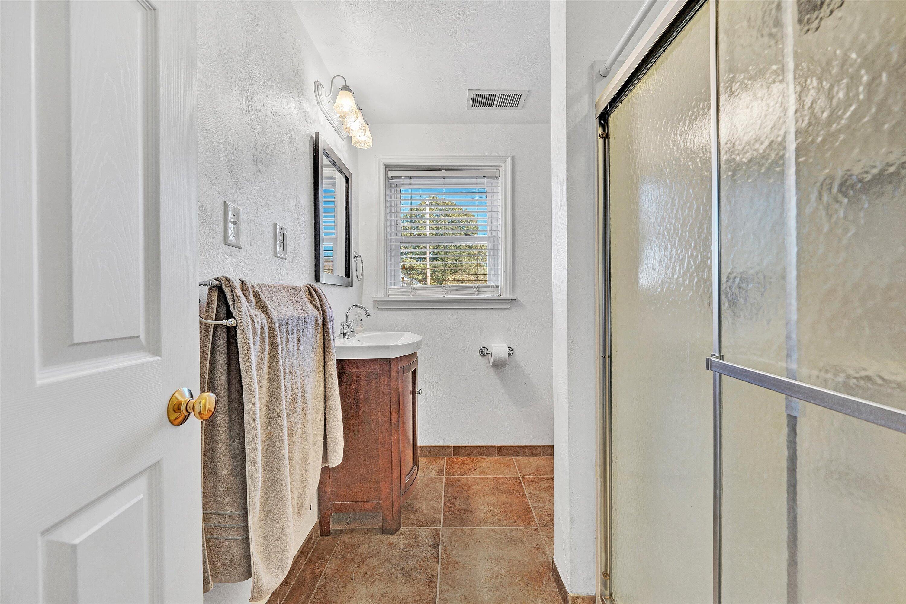 6836 Trevilian Road Roanoke, VA 24019 - Photo 31 of 47 a view of front door with hallway and a bathroom