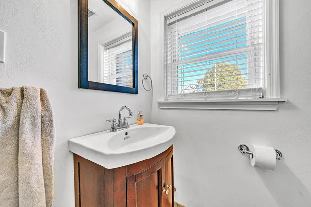 a view of a patio with table and chairs with wooden fence and plants