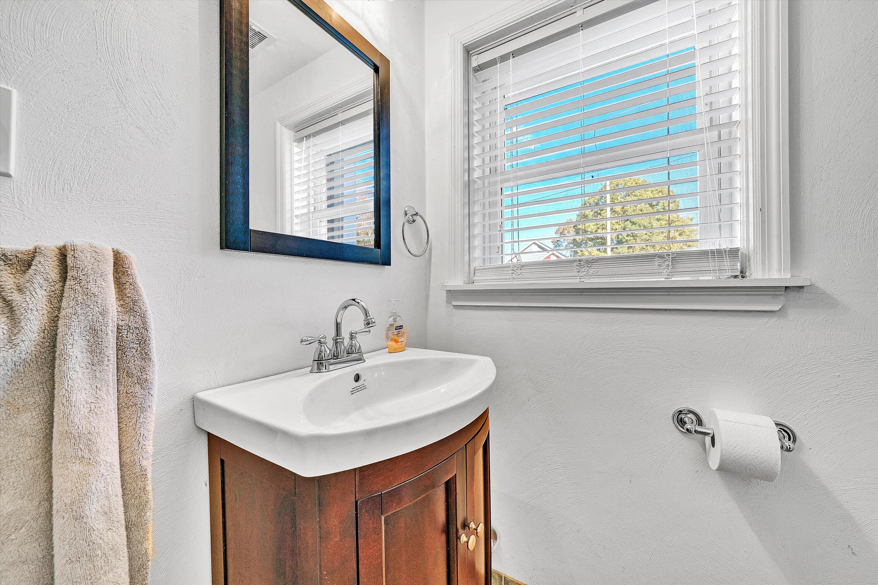 6836 Trevilian Road Roanoke, VA 24019 - Photo 32 of 47 a bathroom with a sink and a mirror