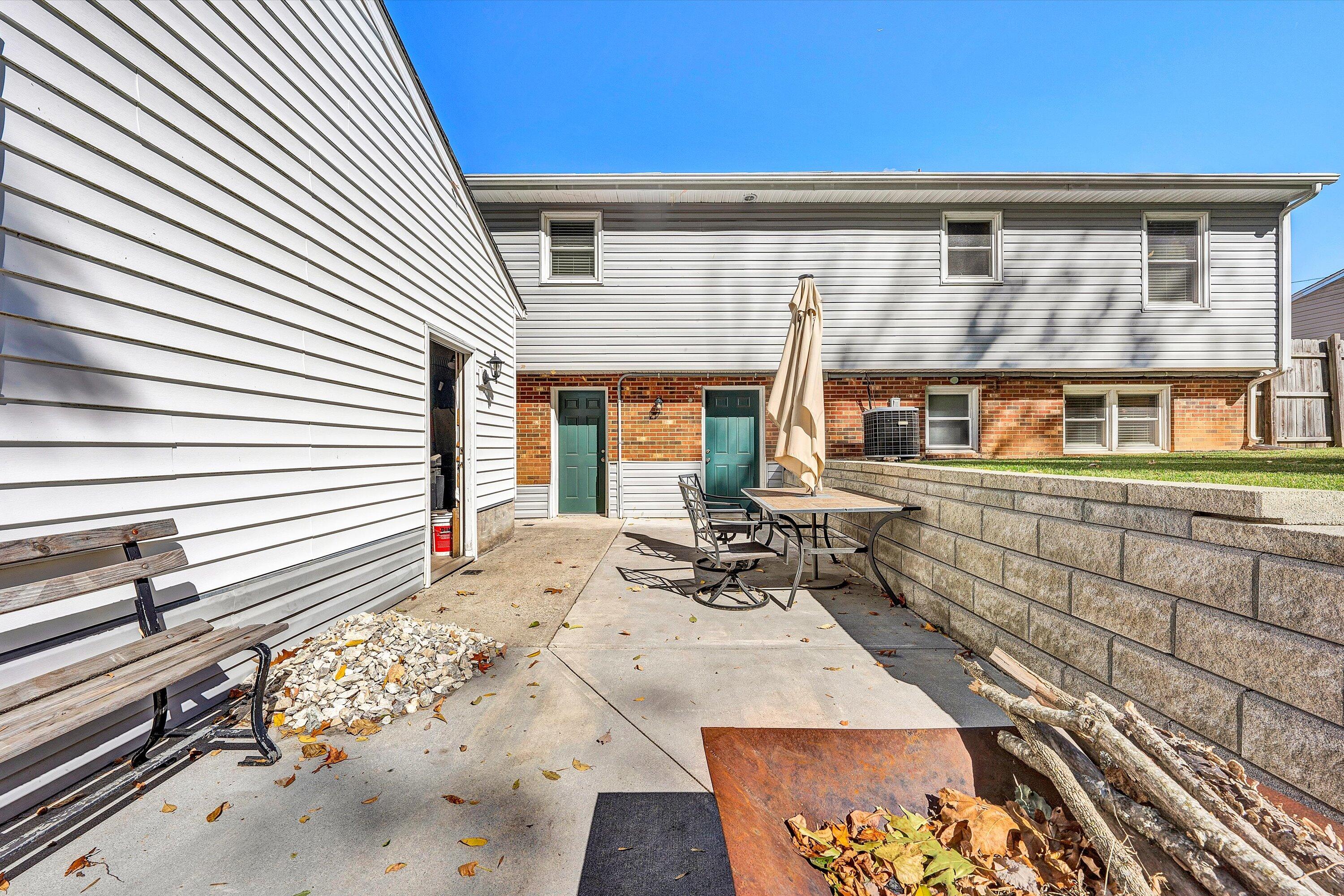 6836 Trevilian Road Roanoke, VA 24019 - Photo 35 of 47 a view of a patio with table and chairs and wooden floor