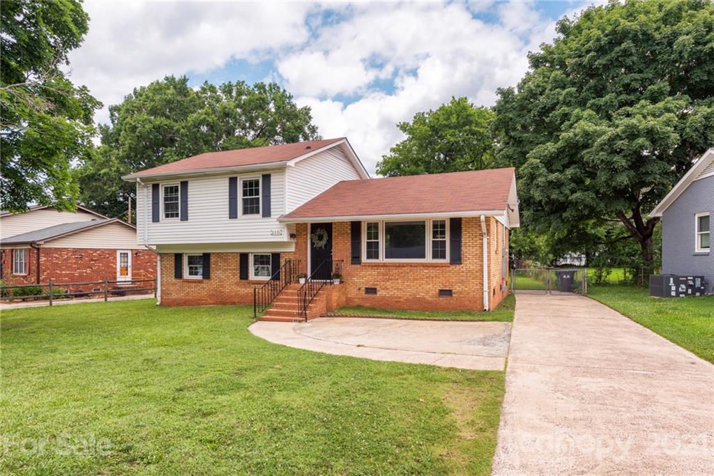 2531 Milton Road Charlotte, NC 28215 - Photo 2 of 19 a front view of a house with a yard porch and tree
