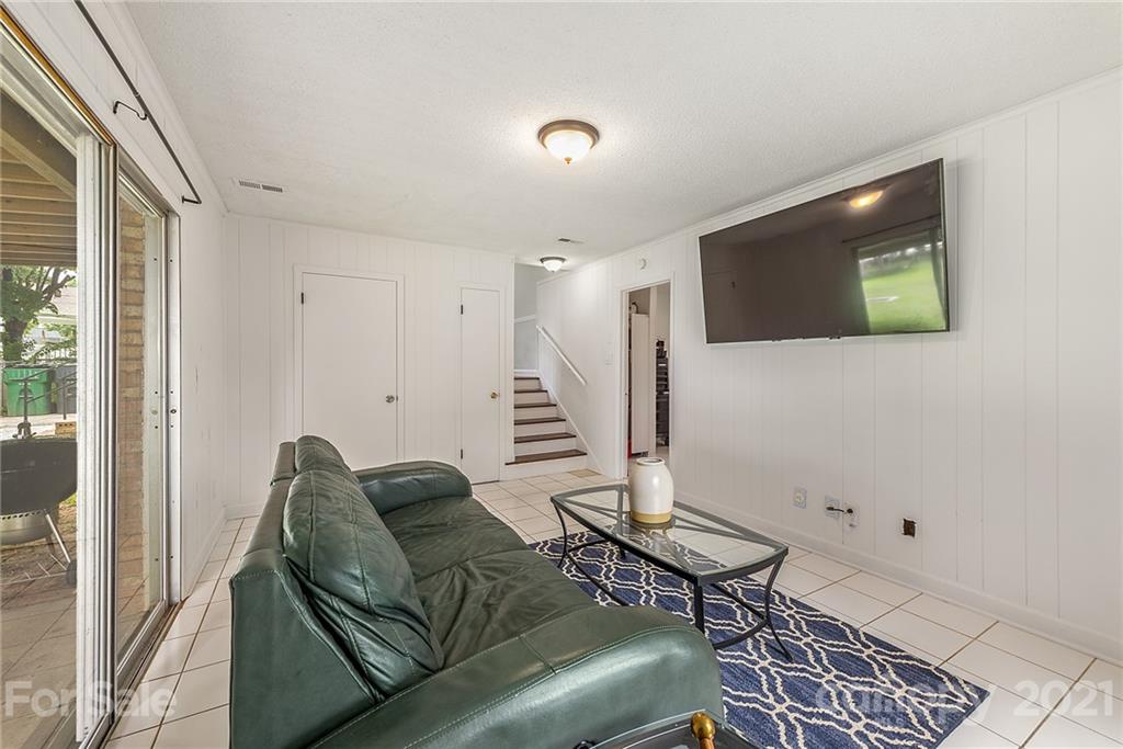 2531 Milton Road Charlotte, NC 28215 - Photo 14 of 19 a living room with furniture and a flat screen tv