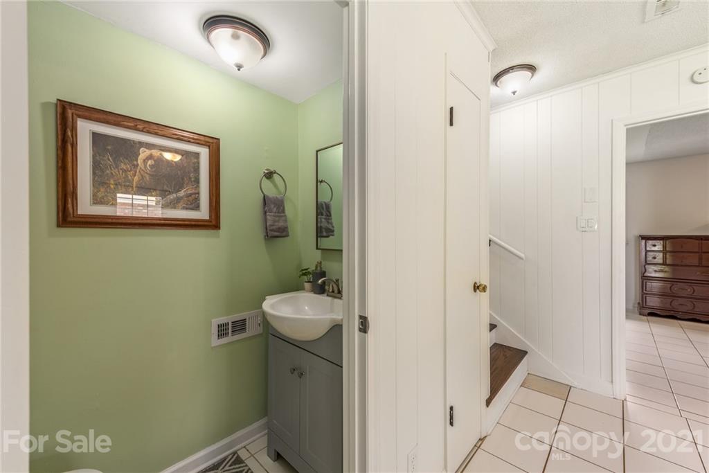 2531 Milton Road Charlotte, NC 28215 - Photo 17 of 19 a bathroom with a sink and mirror