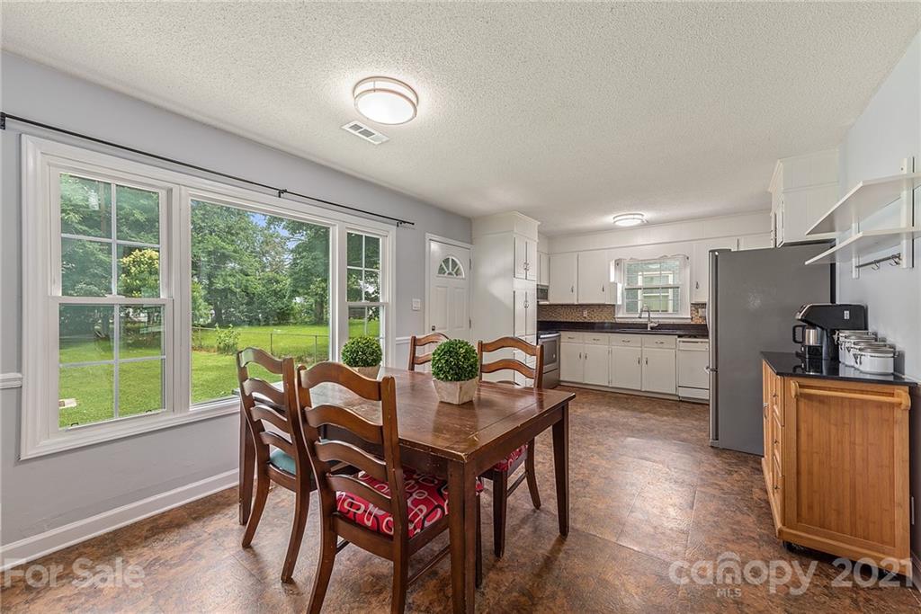 2531 Milton Road Charlotte, NC 28215 - Photo 6 of 19 a view of a dining room with furniture window and outside view