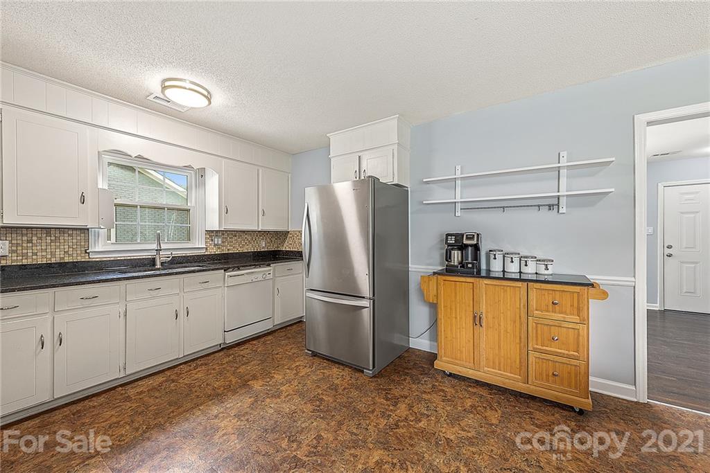2531 Milton Road Charlotte, NC 28215 - Photo 7 of 19 a kitchen with stainless steel appliances granite countertop a refrigerator and a stove