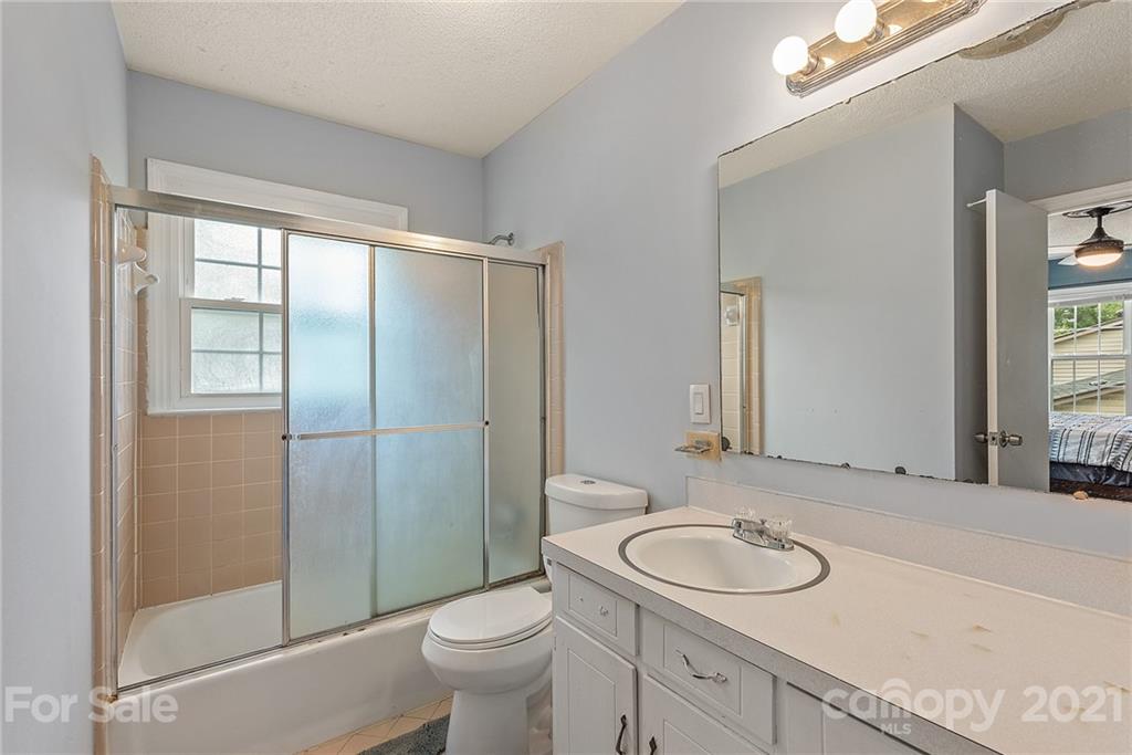 2531 Milton Road Charlotte, NC 28215 - Photo 10 of 19 a bathroom with a sink toilet and shower