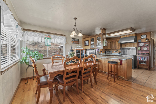 6407 North Dry Frk Cyn Road West Vernal, UT 84078 - Photo 21 of 48 Dining space with plenty of natural light, light wood finished floors, baseboards, and a textured ceiling
