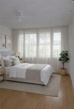 a bedroom with bed and window