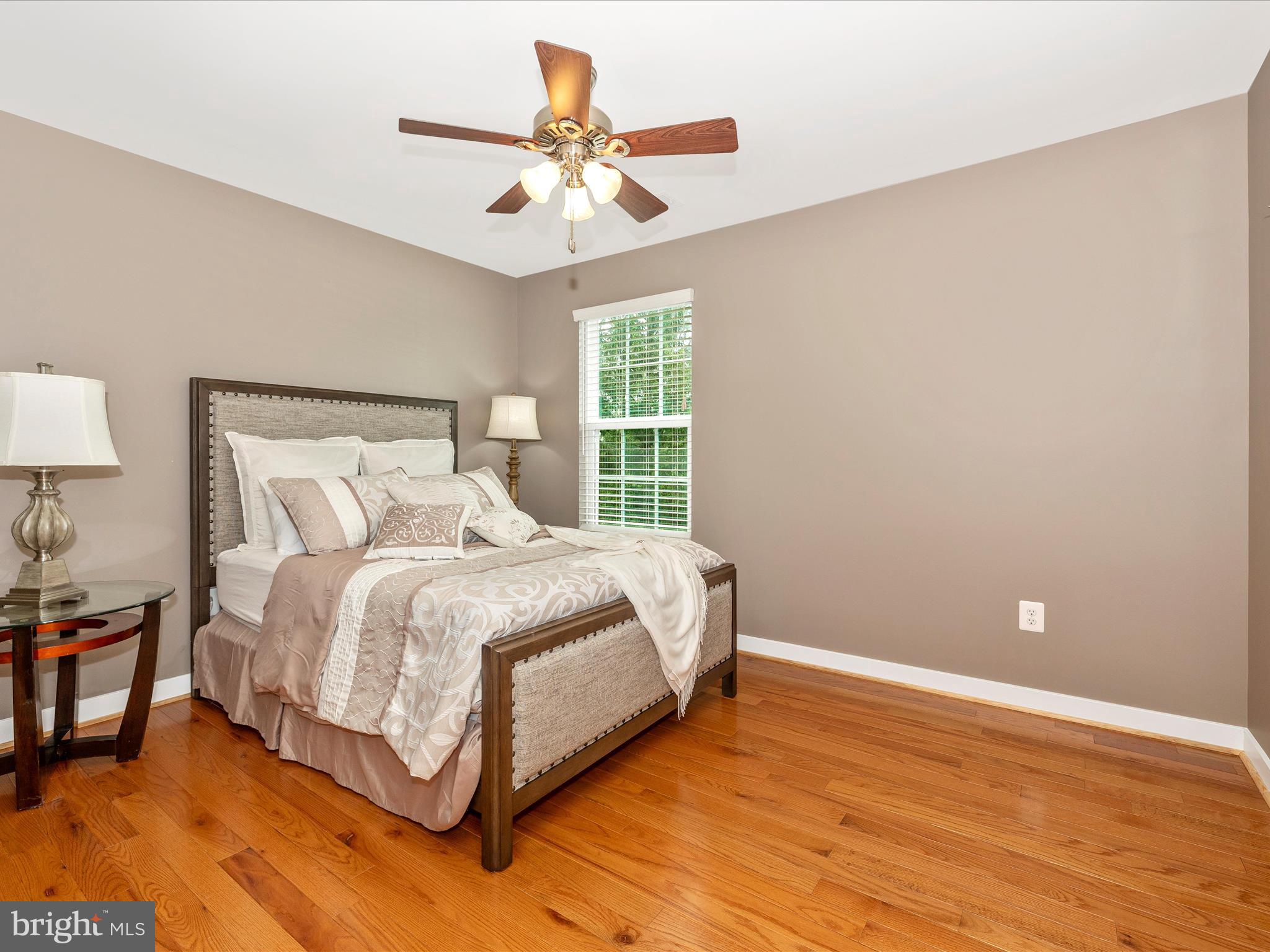 2004 Quandary Drive Frederick, MD 21702 - Photo 27 of 47 a spacious bedroom with a bed and a chandelier