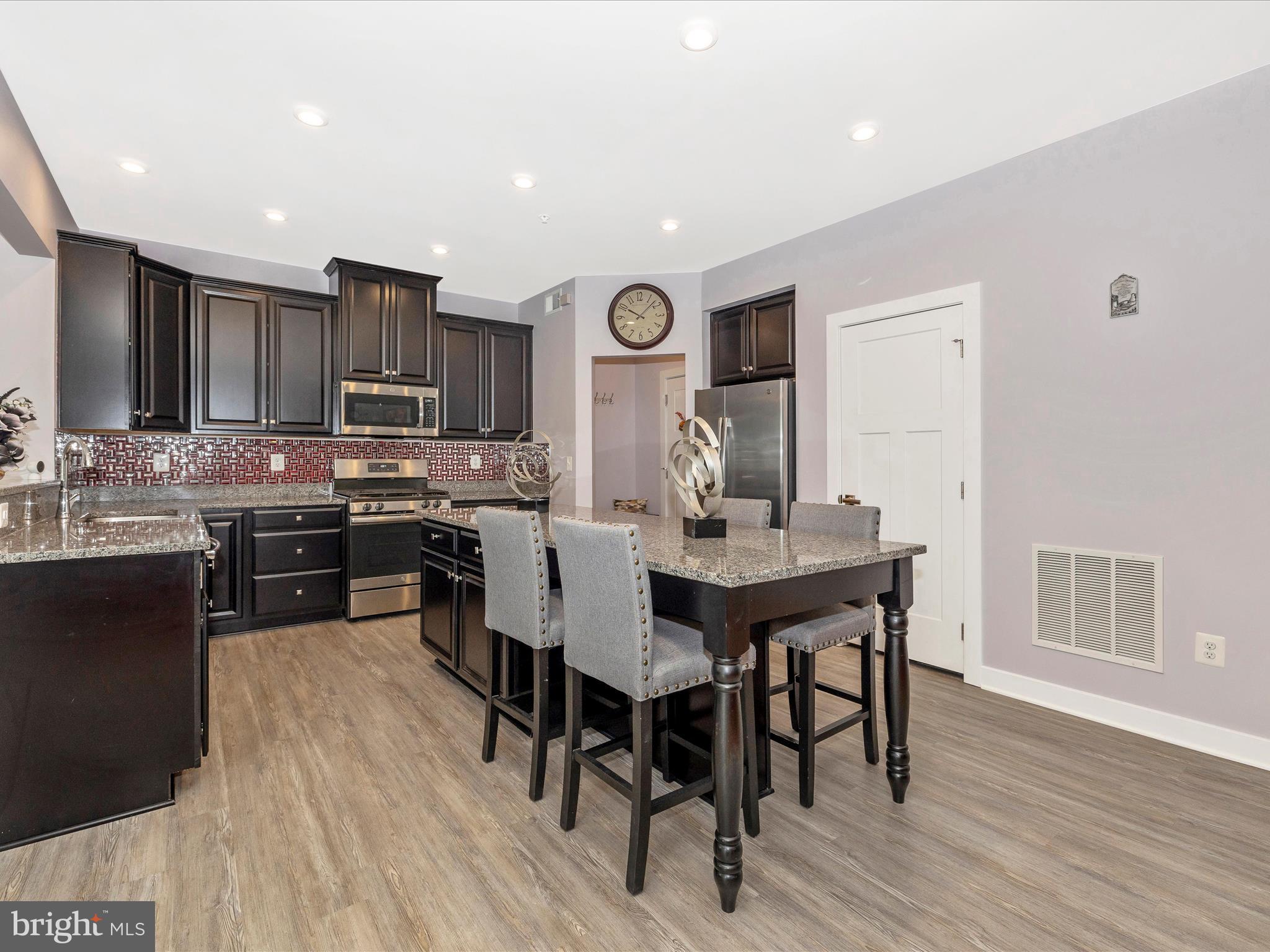 2004 Quandary Drive Frederick, MD 21702 - Photo 10 of 47 a view of a dining room with furniture and wooden floor
