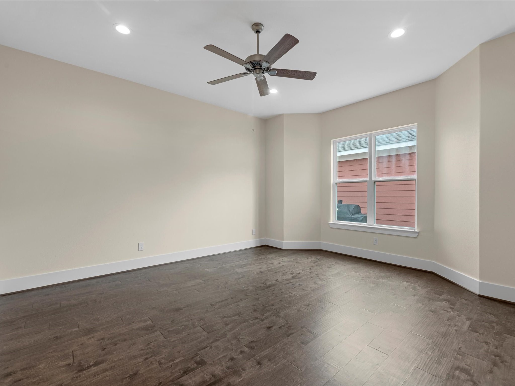 55 Red Harper Drive Spring, TX 77389 - Photo 11 of 28 an empty room with ceiling fan and windows