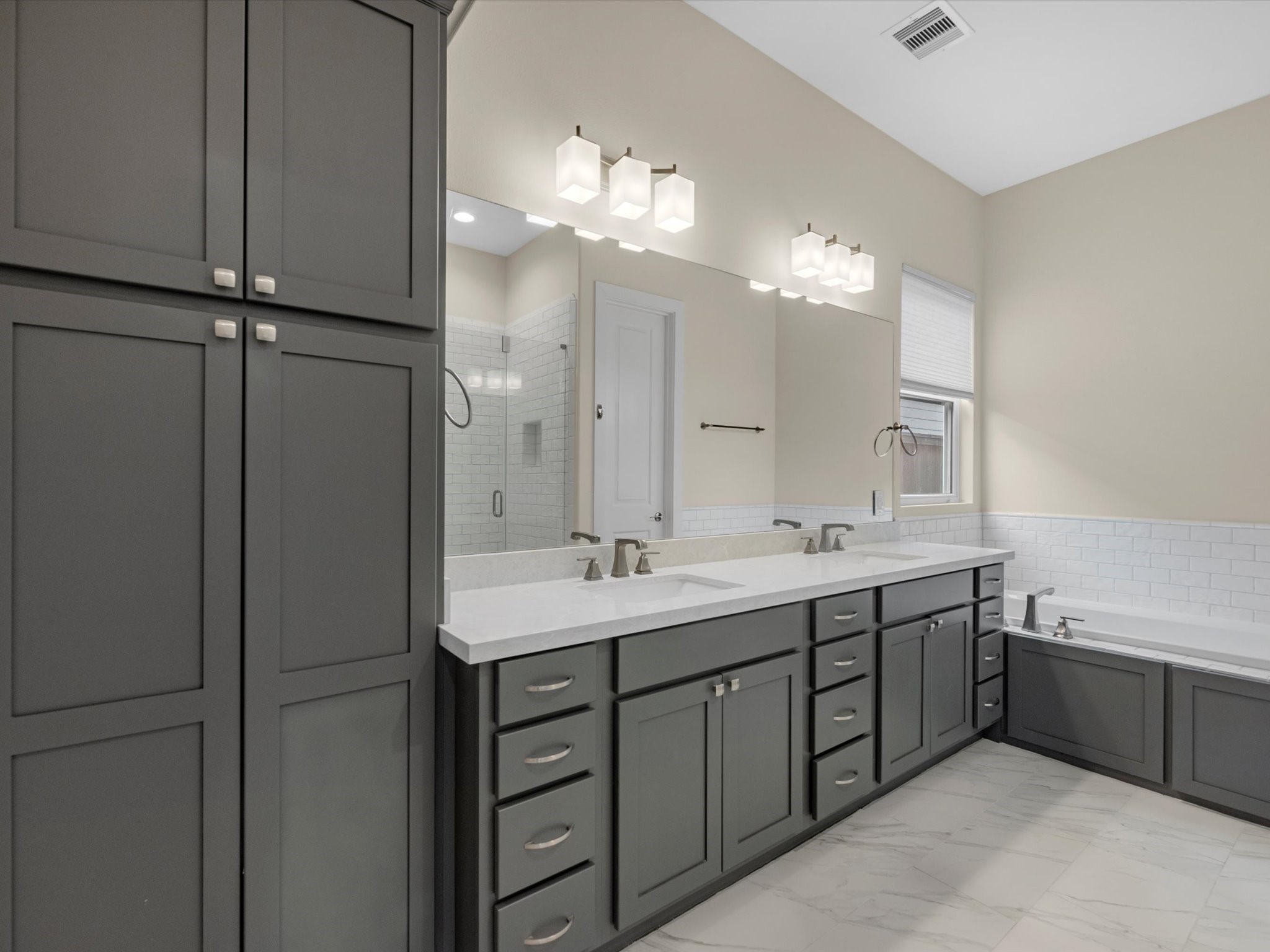 55 Red Harper Drive Spring, TX 77389 - Photo 12 of 28 a bathroom with a double vanity sink and a mirror