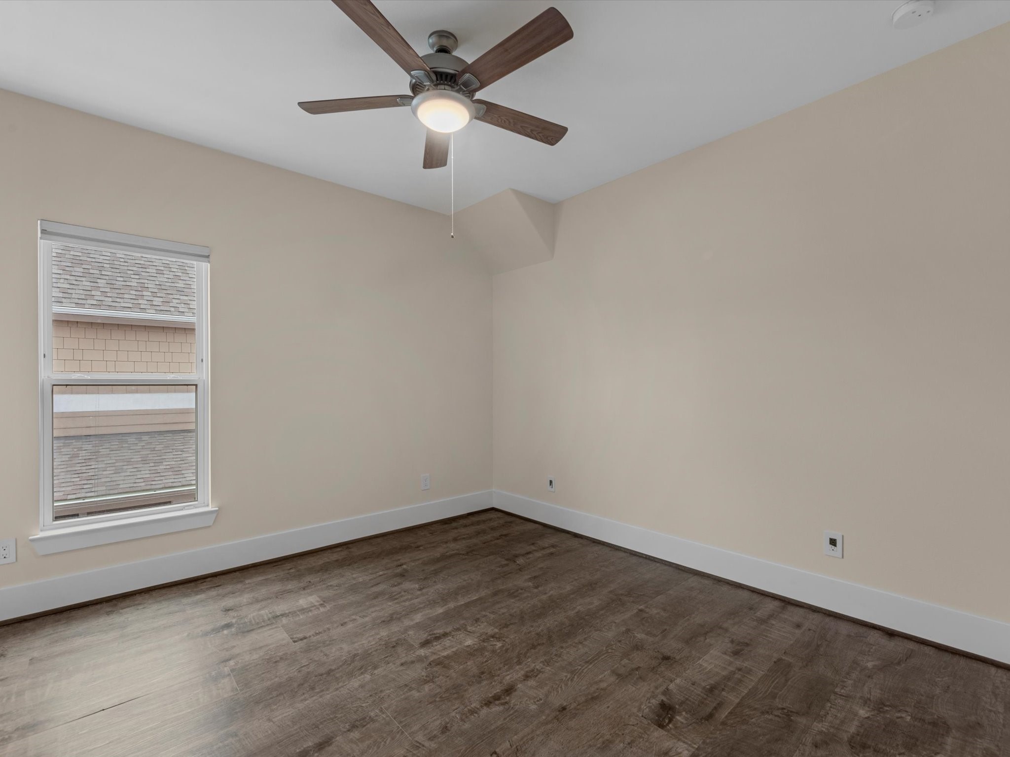 55 Red Harper Drive Spring, TX 77389 - Photo 18 of 28 an empty room with a window and ceiling fan