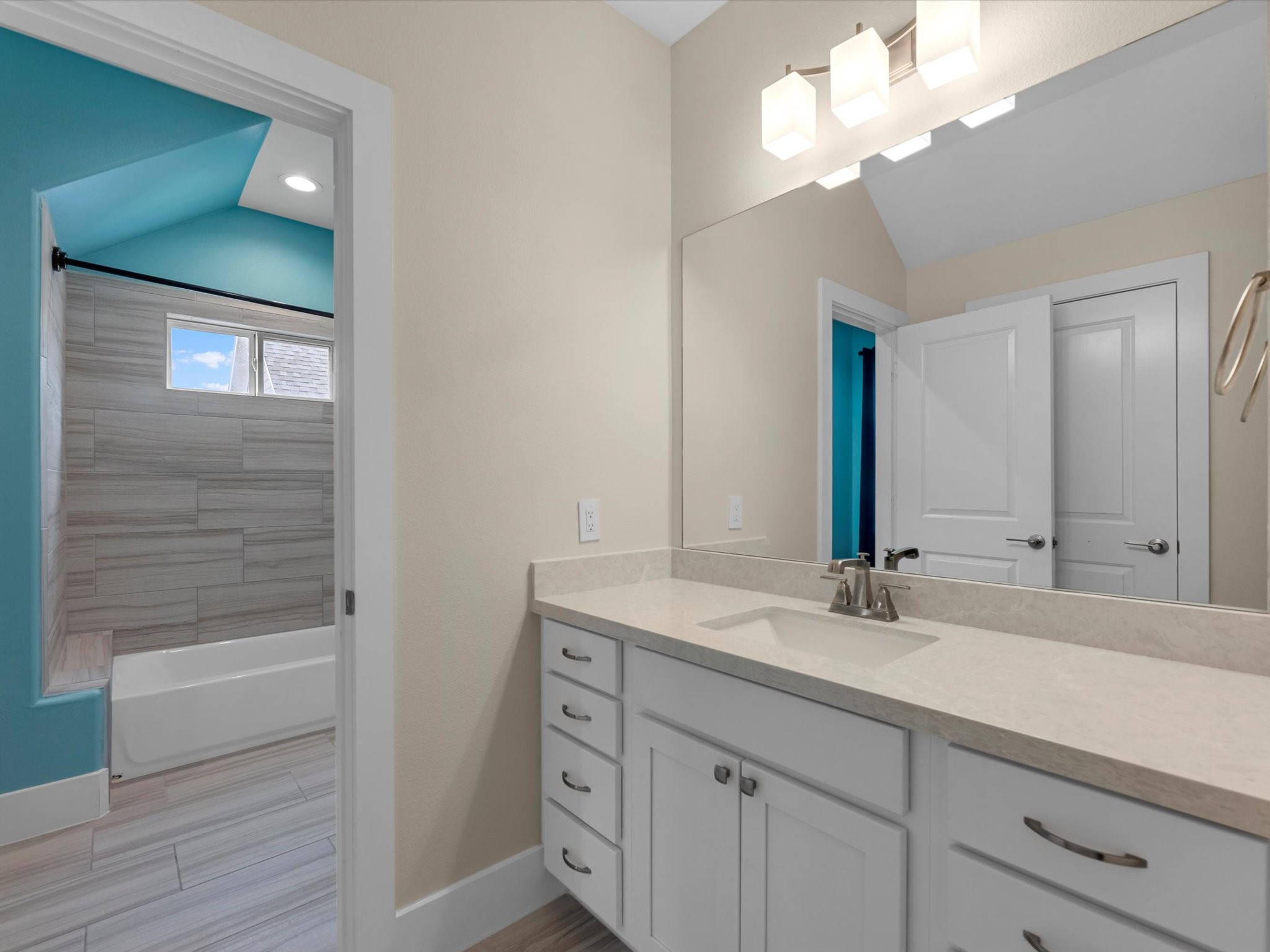 55 Red Harper Drive Spring, TX 77389 - Photo 19 of 28 a bathroom with a sink a light fixture and a mirror